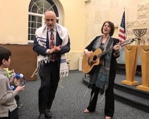 rabbi and cantor leading a service