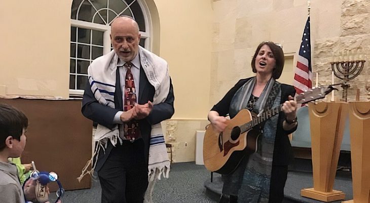 rabbi and cantor leading a service