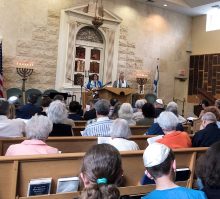 rabbi and cantor leading shabbat service